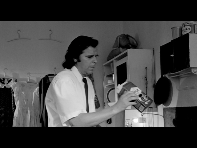 Man inspects empty Juhla Mokka containers